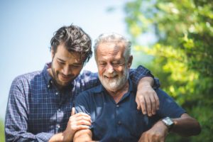 a man and his father discuss the benefits of respite care