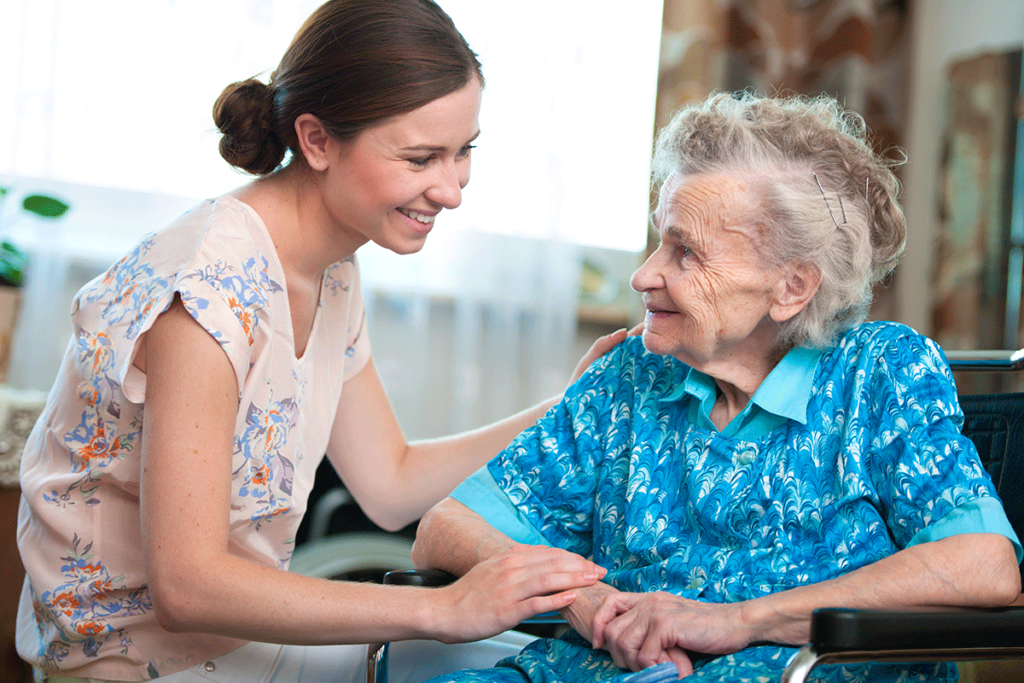 younger woman explaining to older woman the 5 benefits of respite care
