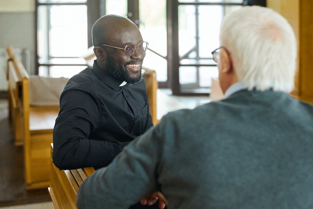 A chaplian and a senior discuss the role of chaplains in senior settings