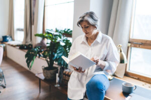 A woman looks over floor plans at Buckner Calder Woods