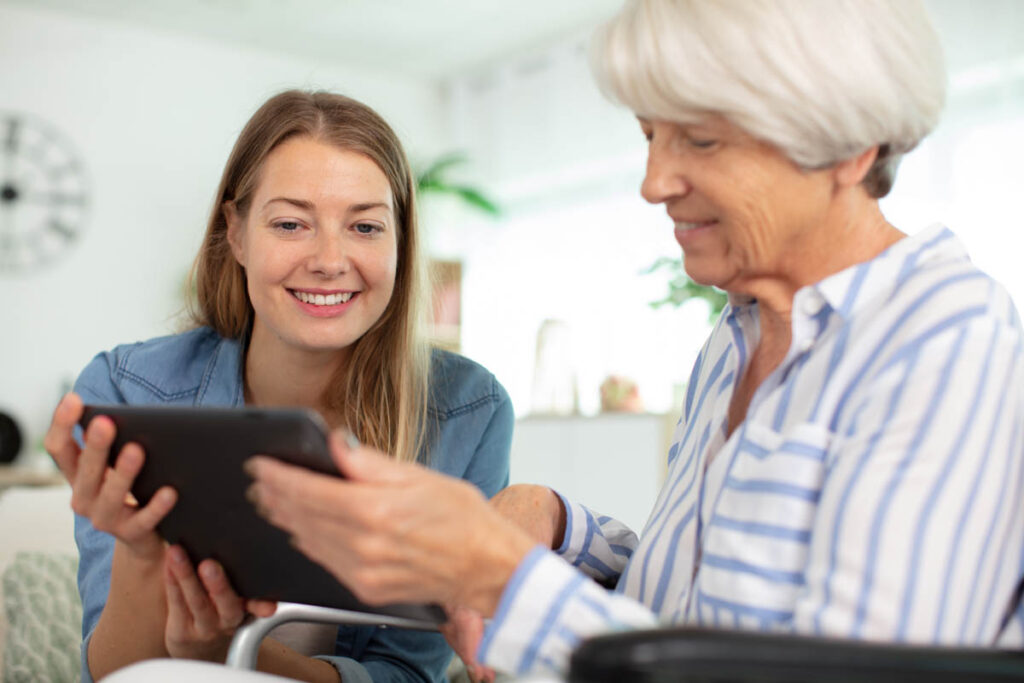 young senior living services professional discussing with an older woman how much does memory care cost in Beaumont, TX?