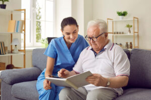 senior living professional explaining to senior citizen about the latest advances in Alzheimer's and dementia care and what's new in 2024.