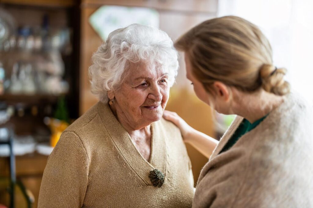 middle-aged woman talking with her elderly mother about dementia care in Texas