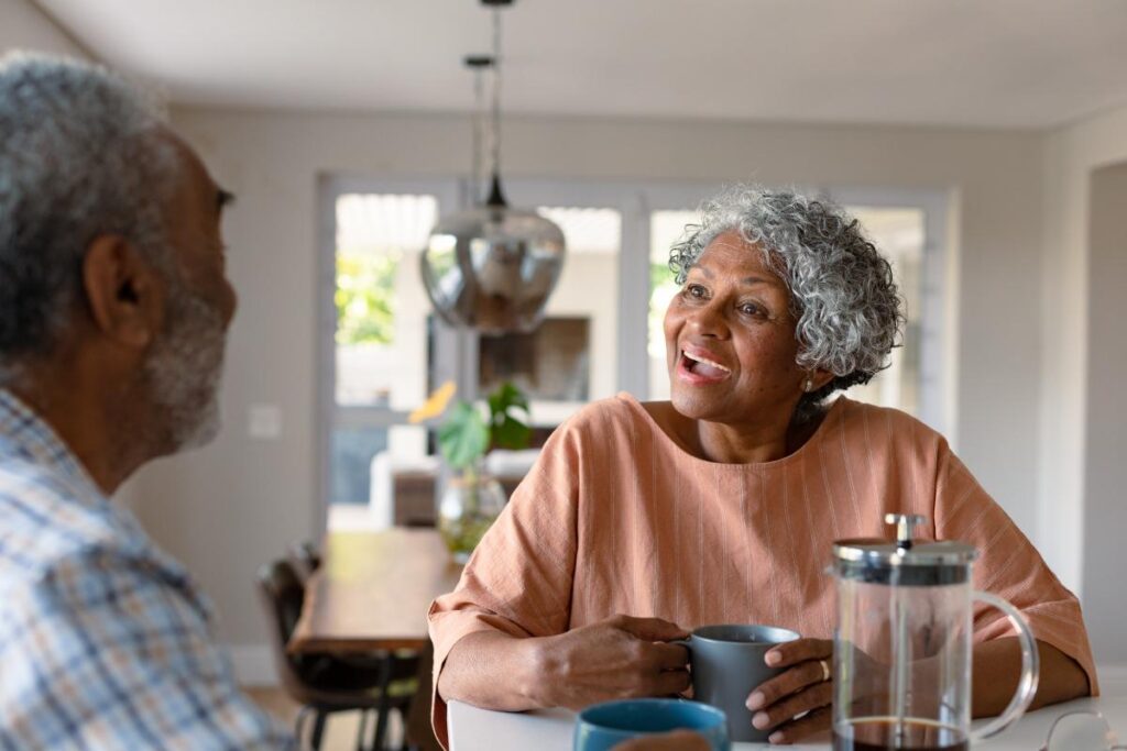 a couple of senior citizens discussing retirement hiomes near Beaumont, TX, as part of their retirement planning.